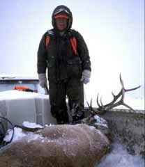 Chuck Yeager Standing Over Elk